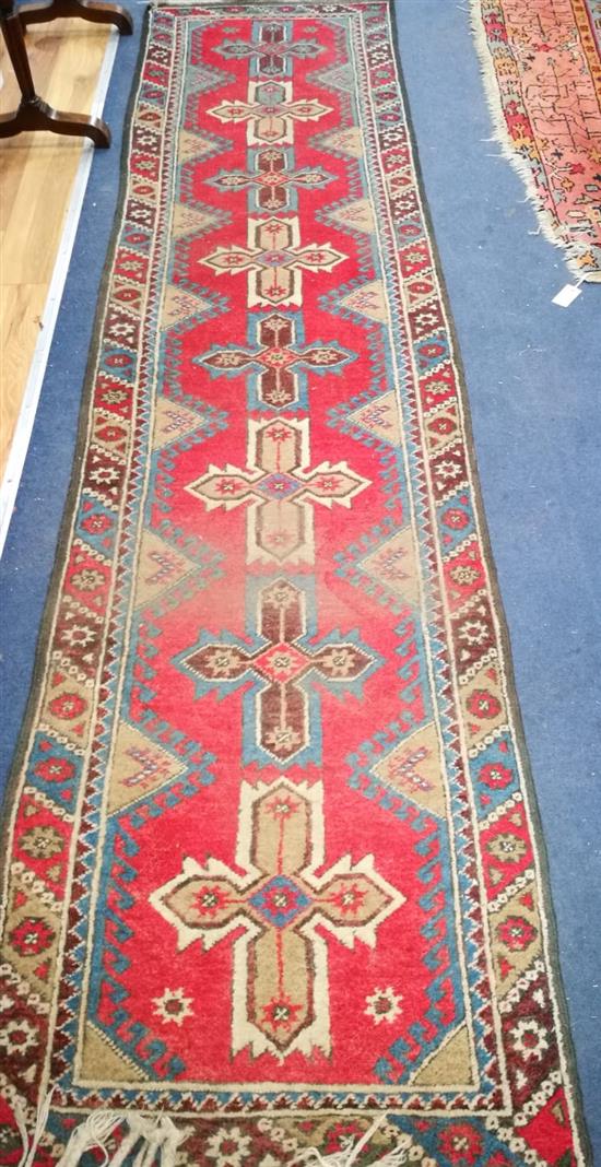 A Persian blue ground runner 305 x 65cm